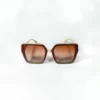Oversized square sunglasses with a cream-colored frame, brown-to-clear gradient lenses