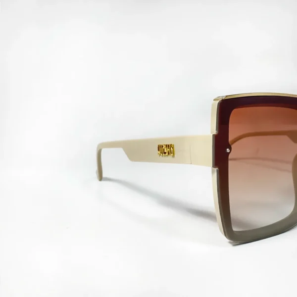 Oversized square sunglasses with a cream-colored frame, brown-to-clear gradient lenses