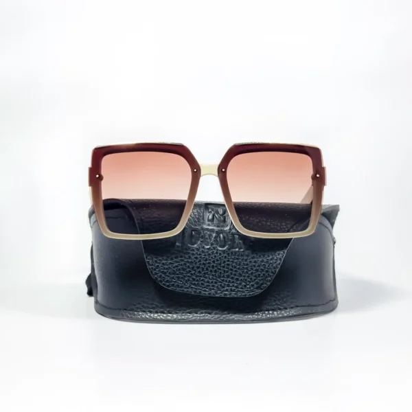 Oversized square sunglasses with a cream-colored frame, brown-to-clear gradient lenses