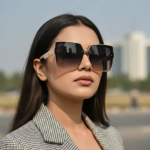 Oversized square sunglasses with a Pink-colored frame, brown-to-clear gradient lenses